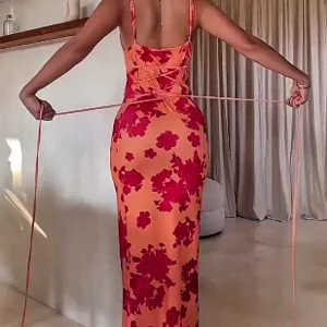 Wholesale of sexy backless lace-up and printed halter dresses for women in summer 2025