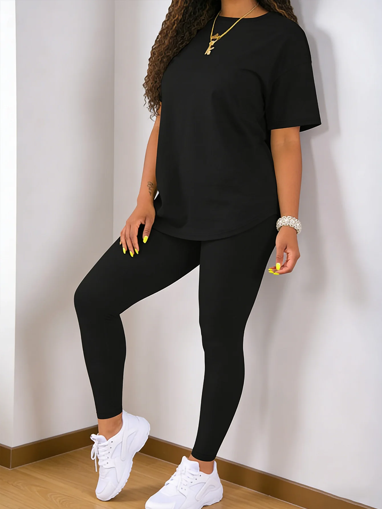 Fashion round-neck short-sleeved top paired with tight-fitting long pants - women's two-piece solid-color set